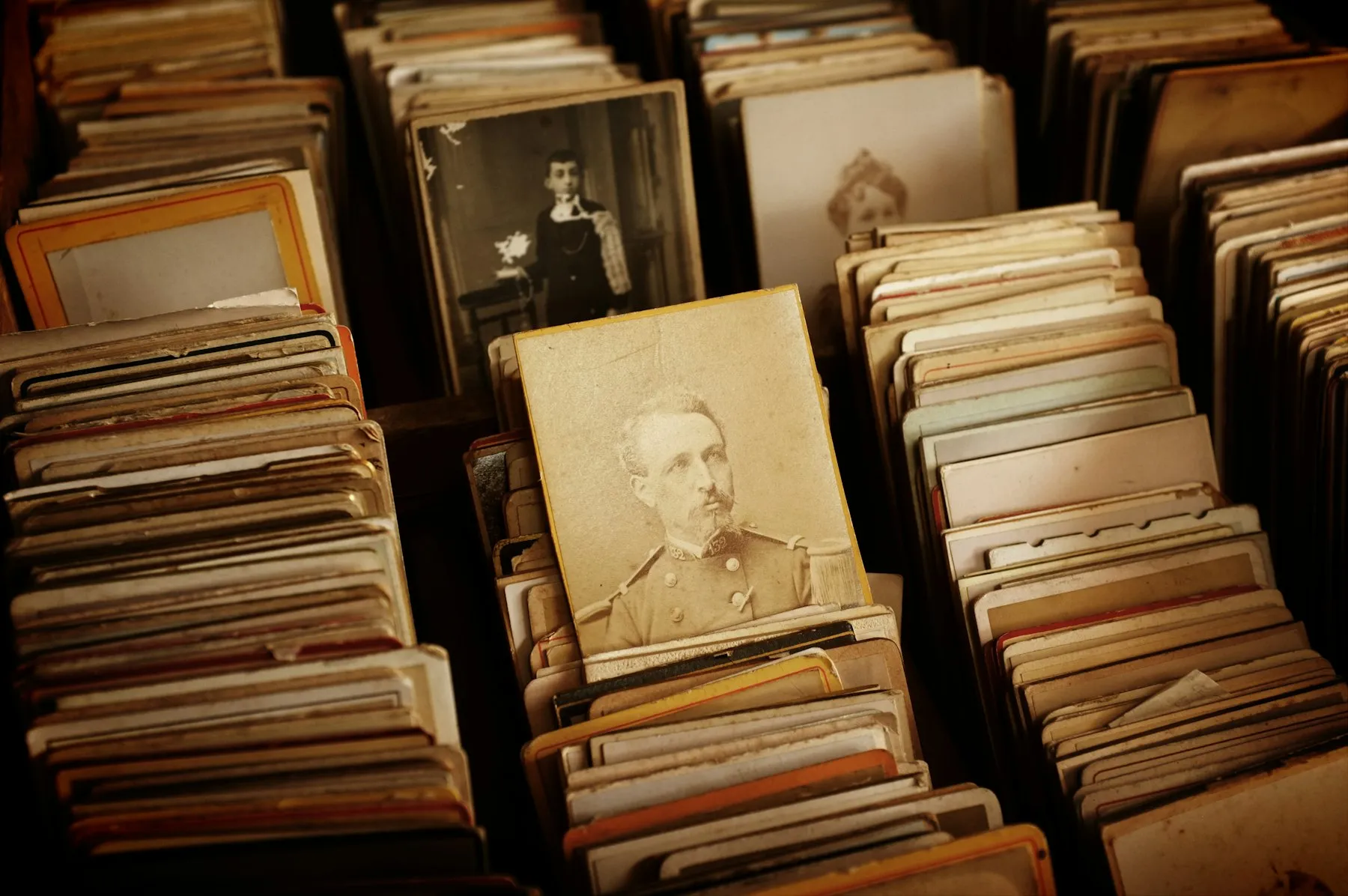 Boxes of old photographs and documents in an archive